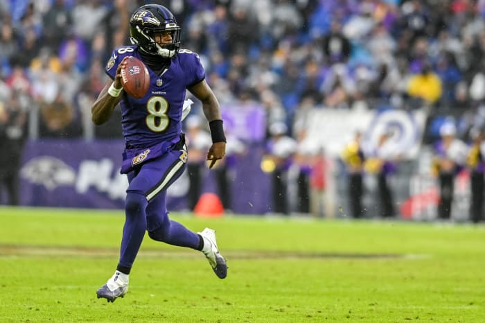 Dec 10, 2023; Baltimore, Maryland, USA; Baltimore Ravens quarterback Lamar Jackson (8) rolls out to pass during the second half against the Los Angeles Rams at M&T Bank Stadium. Mandatory Credit: Tommy Gilligan-USA TODAY Sports